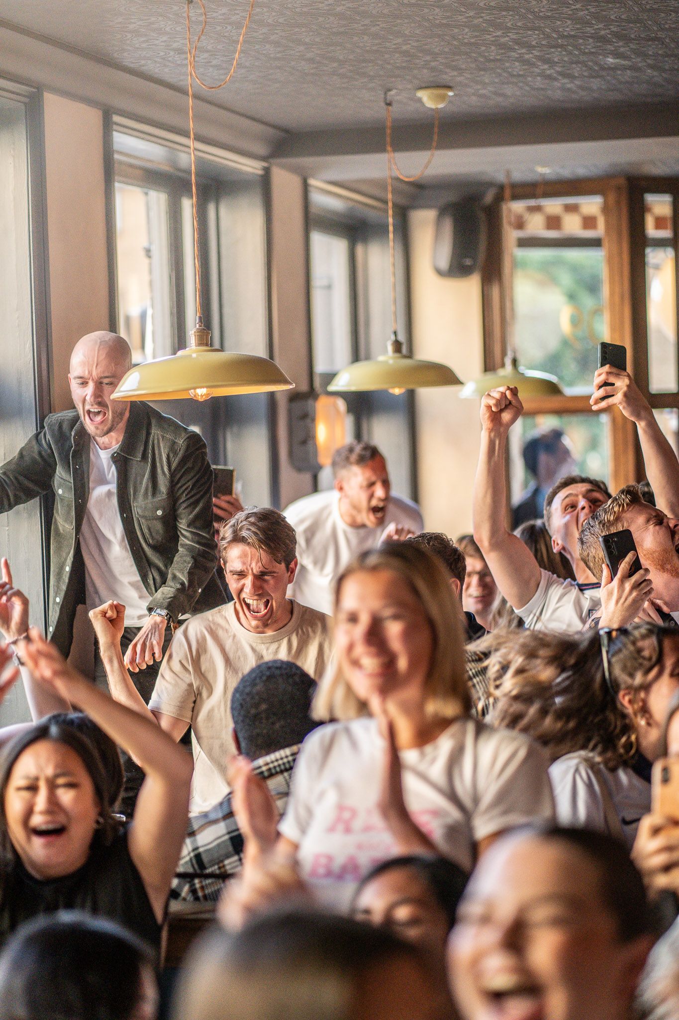 Rugby fans watching live sport at Clapham North Pub in London