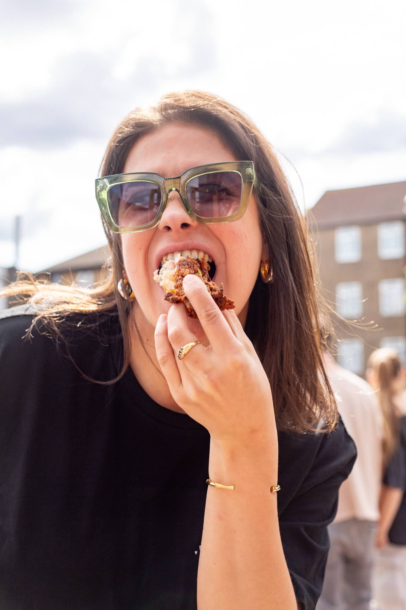 Woman enjoying pub food at Clapham North Pub during the Autumn Nations