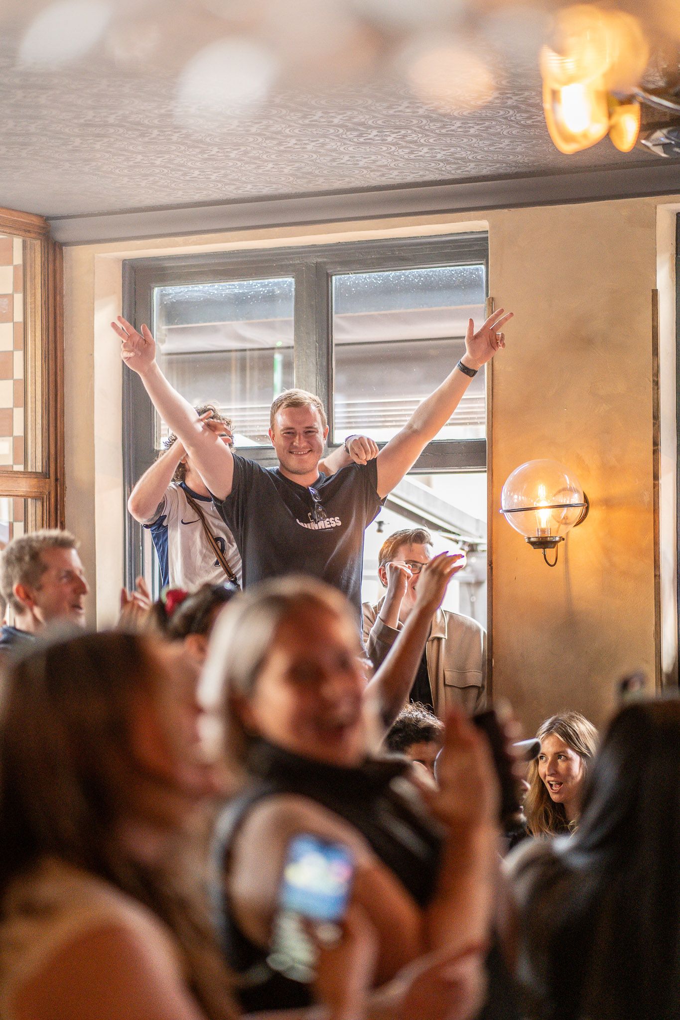 Rugby fan celebrating during a live match at Clapham North Pub